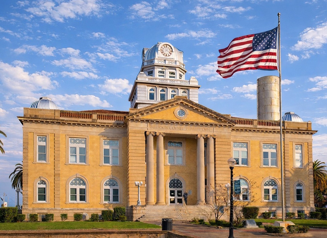 We Are Independent - Golden stone and brick government building with the American flag